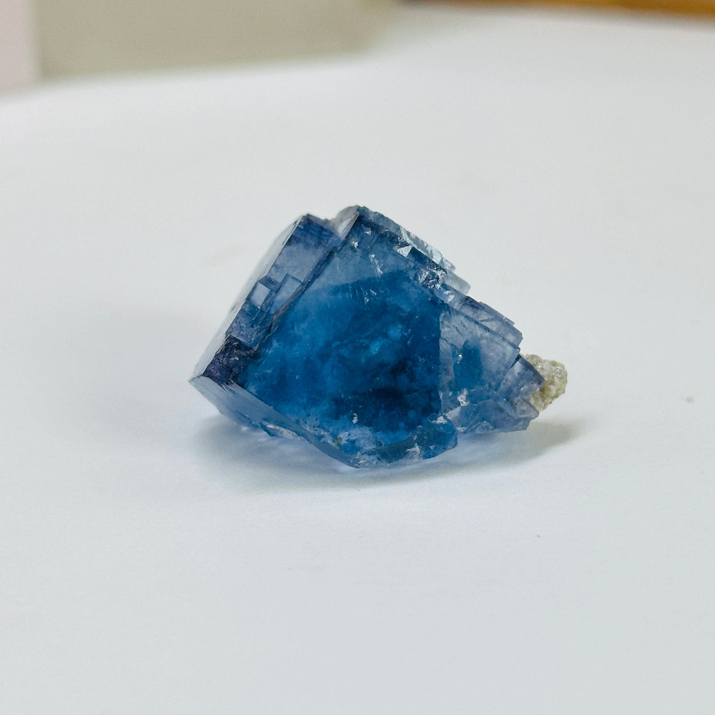 blue fluorite with decorations in the background