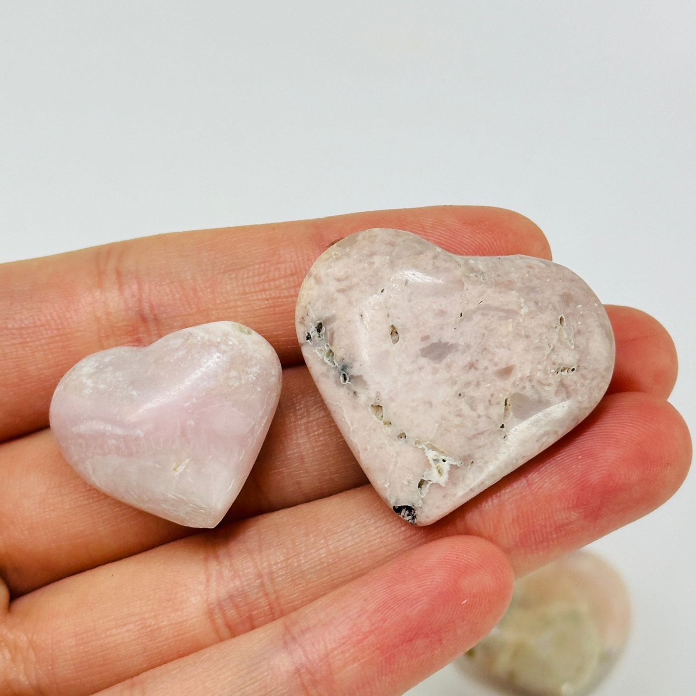 pink opal hearts with decorations in the background