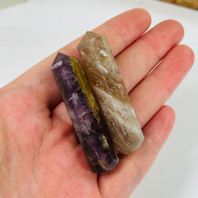 amethyst massage wand with decorations in the background