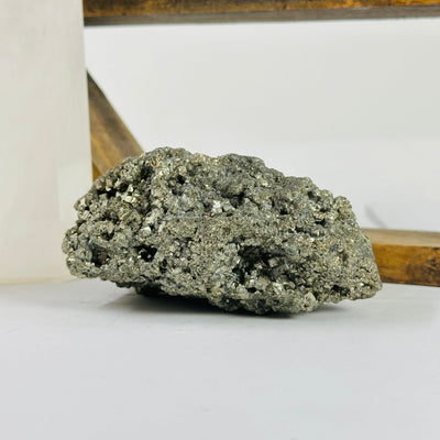 pyrite cluster with decorations in the background