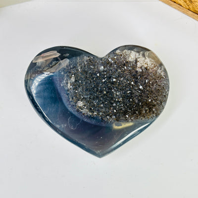 agate heart with decorations in the background