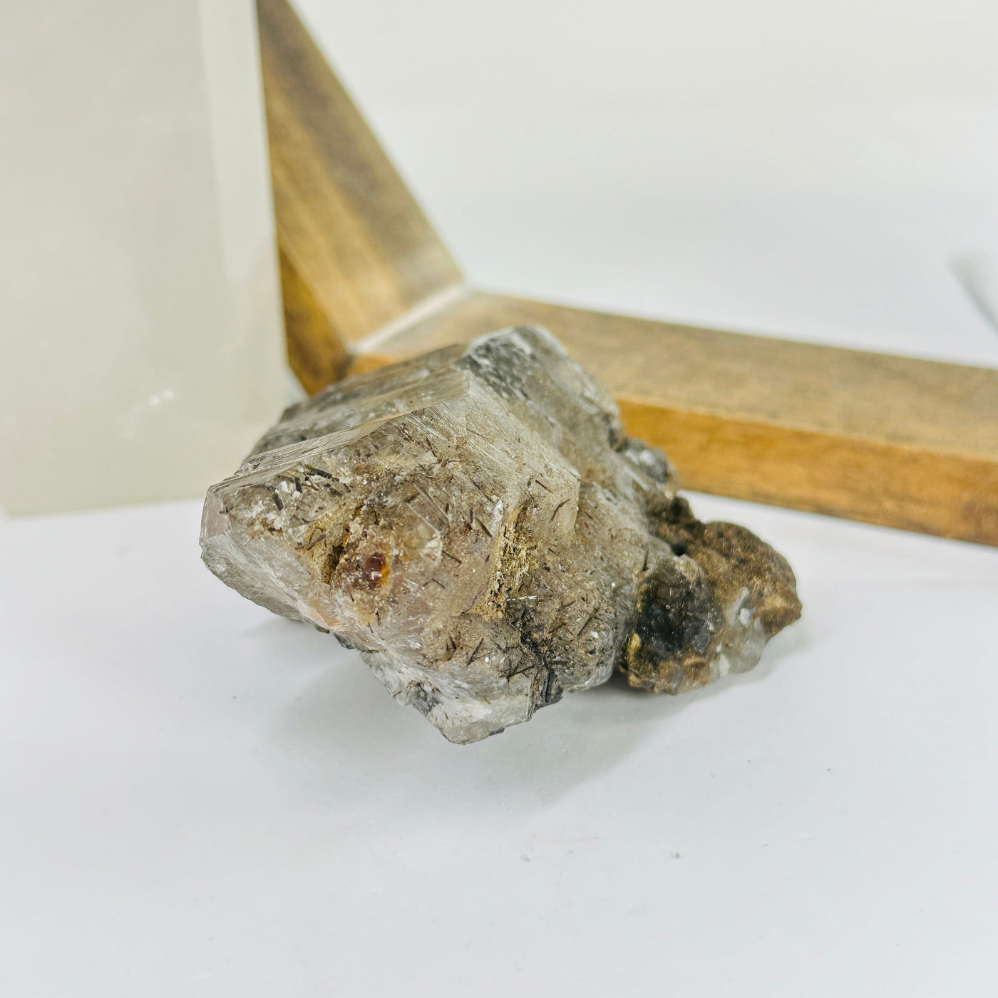 rutile quartz with decorations in the background