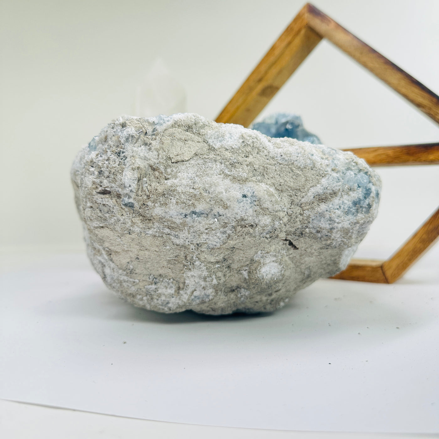 Celestite with decorations in the background