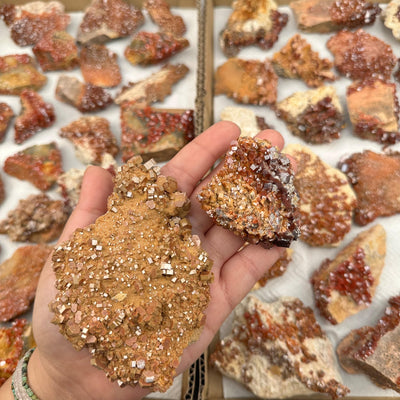 Raw Vanadinite Specimen in hand for size reference 