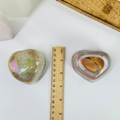 angel aura agate heart next to a ruler for size reference