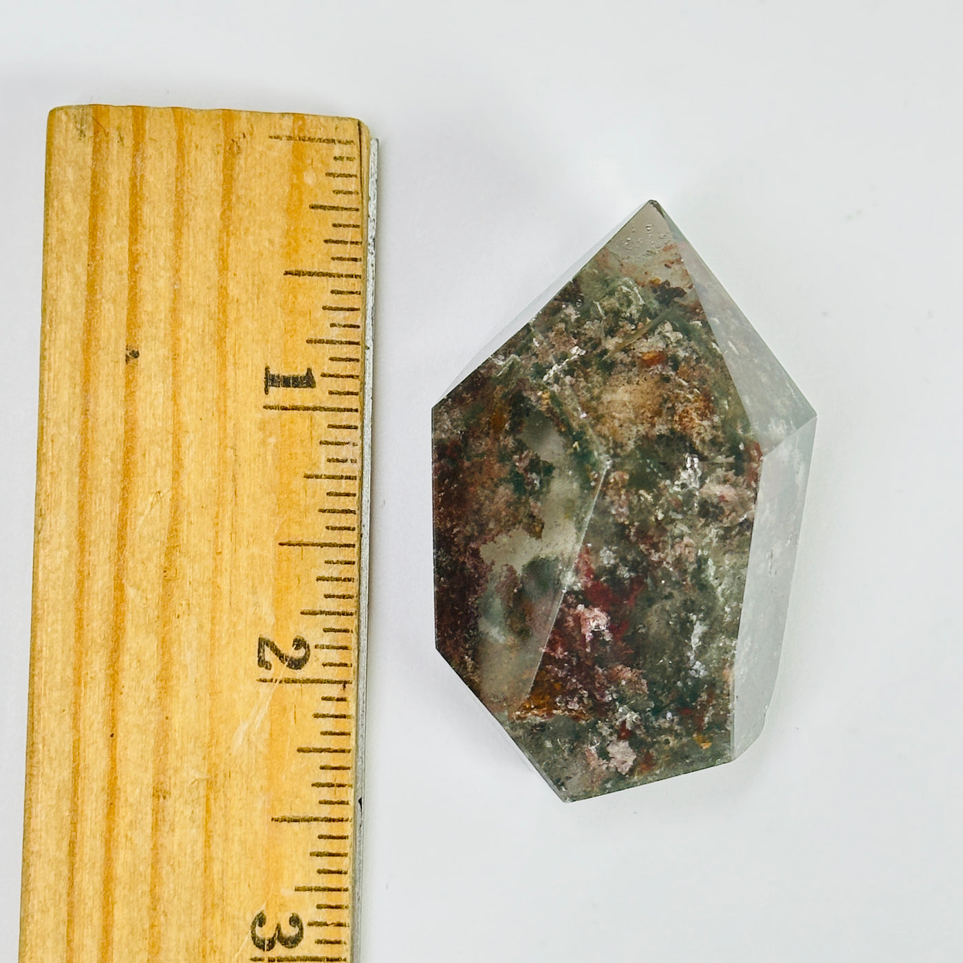 garden quartz next to a ruler for size reference