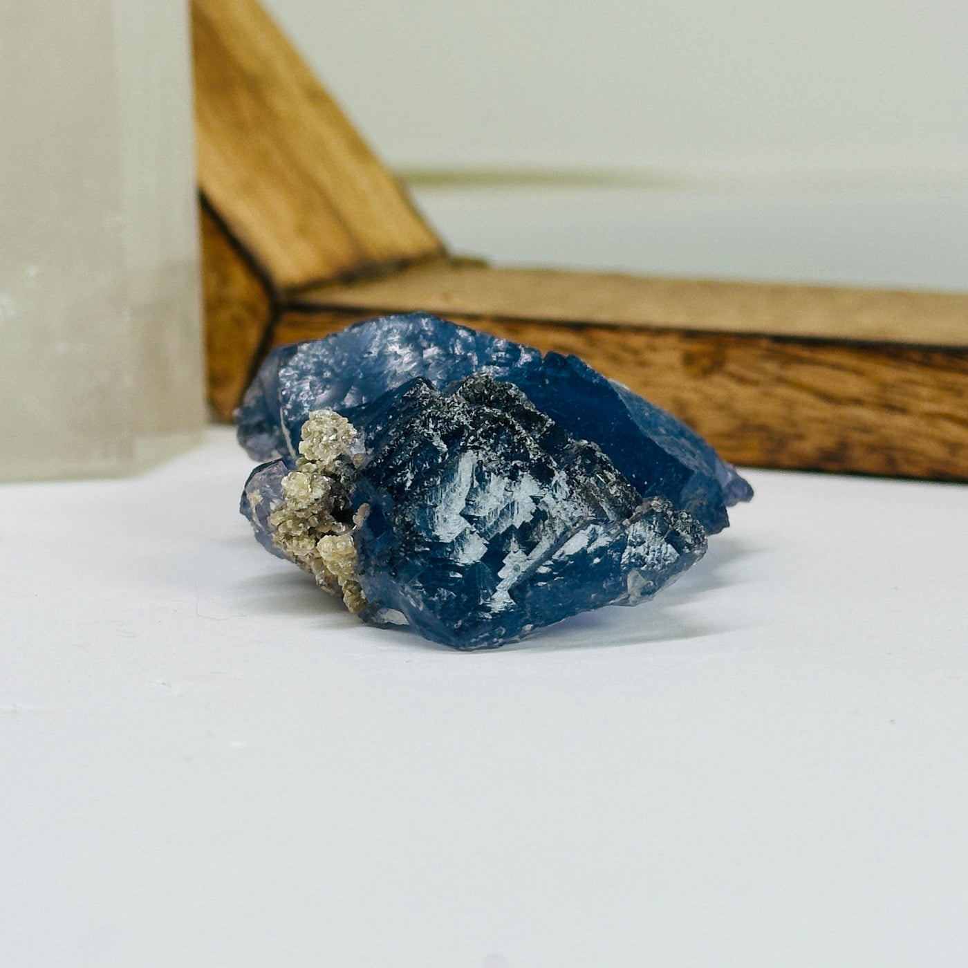 blue fluorite with decorations in the background