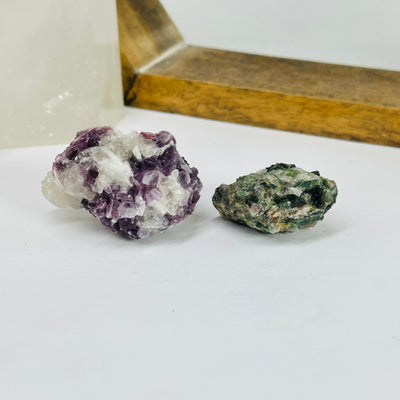 watermelon tourmaline with decorations in the background