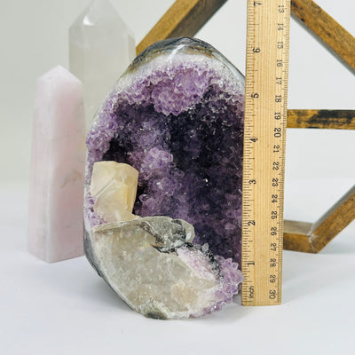 amethyst cut base next to a ruler for size reference