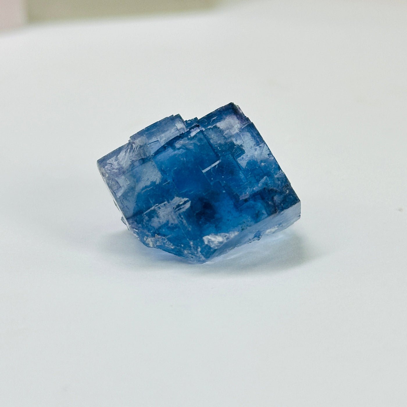 blue fluorite with decorations in the background