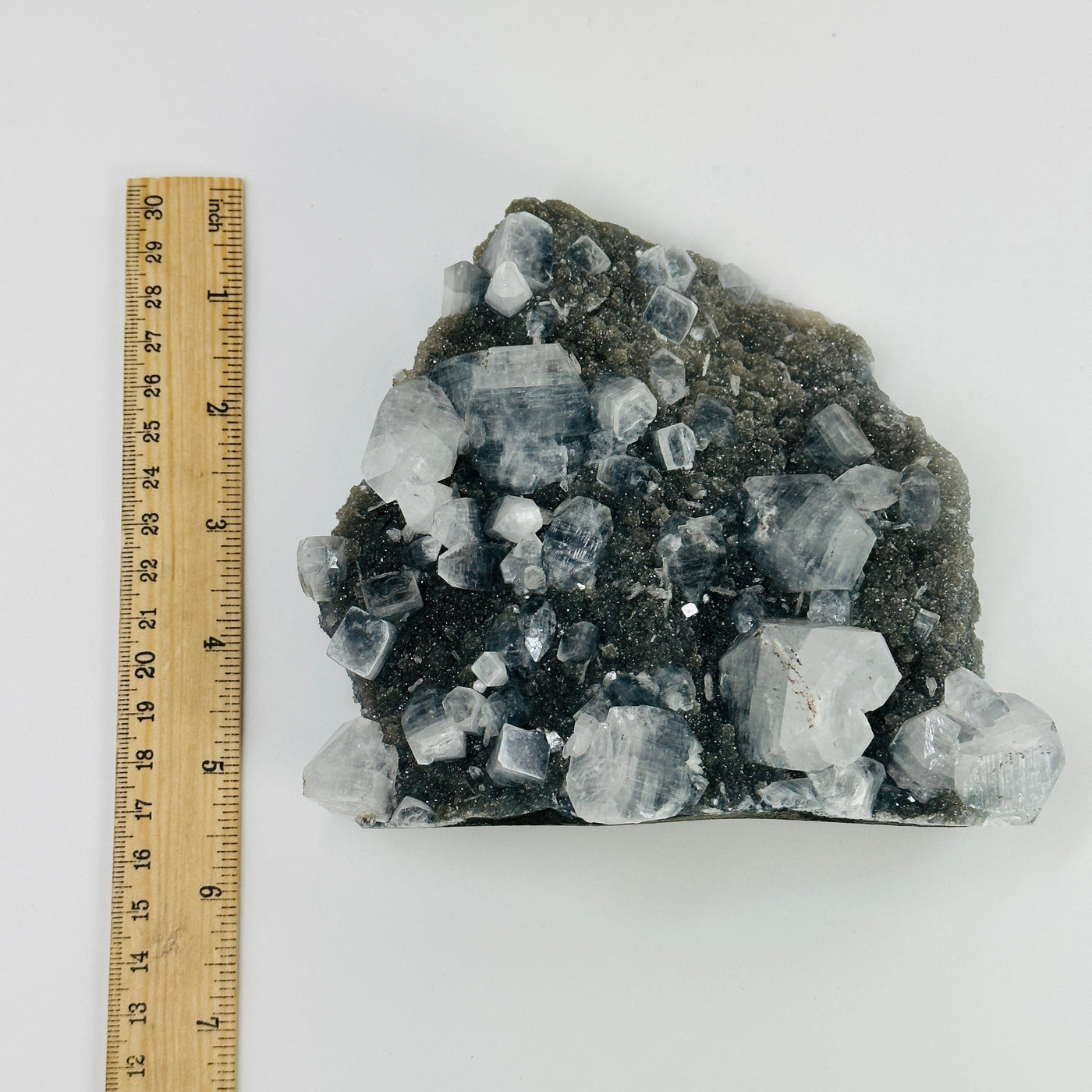 apophyllite cut base next to a ruler for size reference 