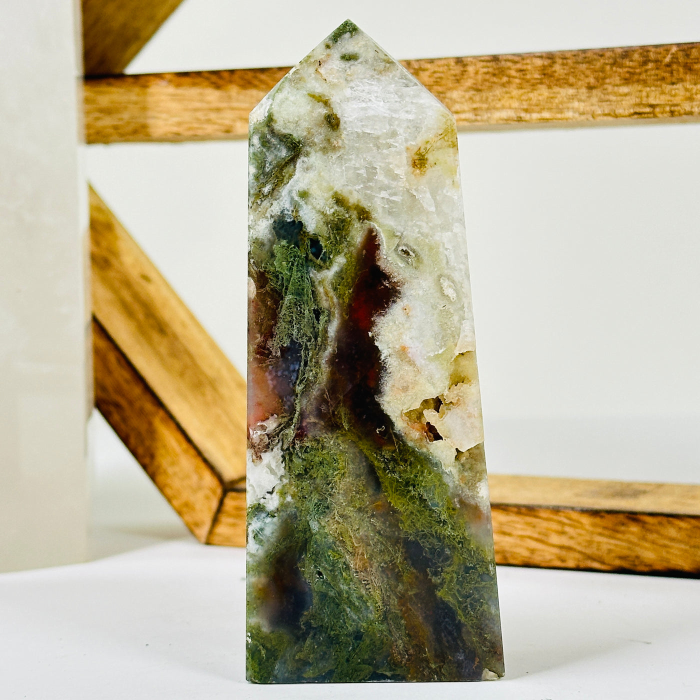 moss agate with decorations in the background