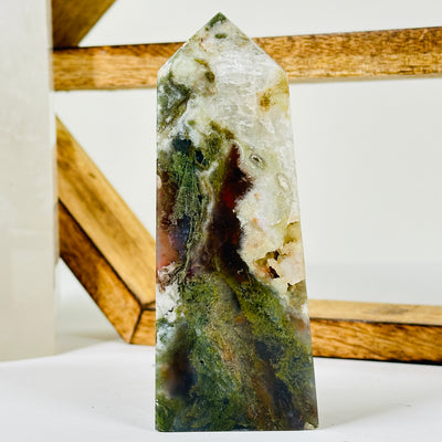 moss agate with decorations in the background