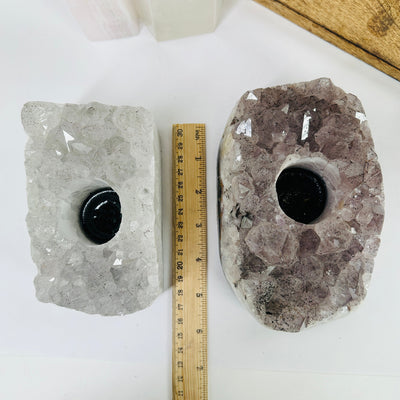 amethyst candle holder next to a ruler for size reference