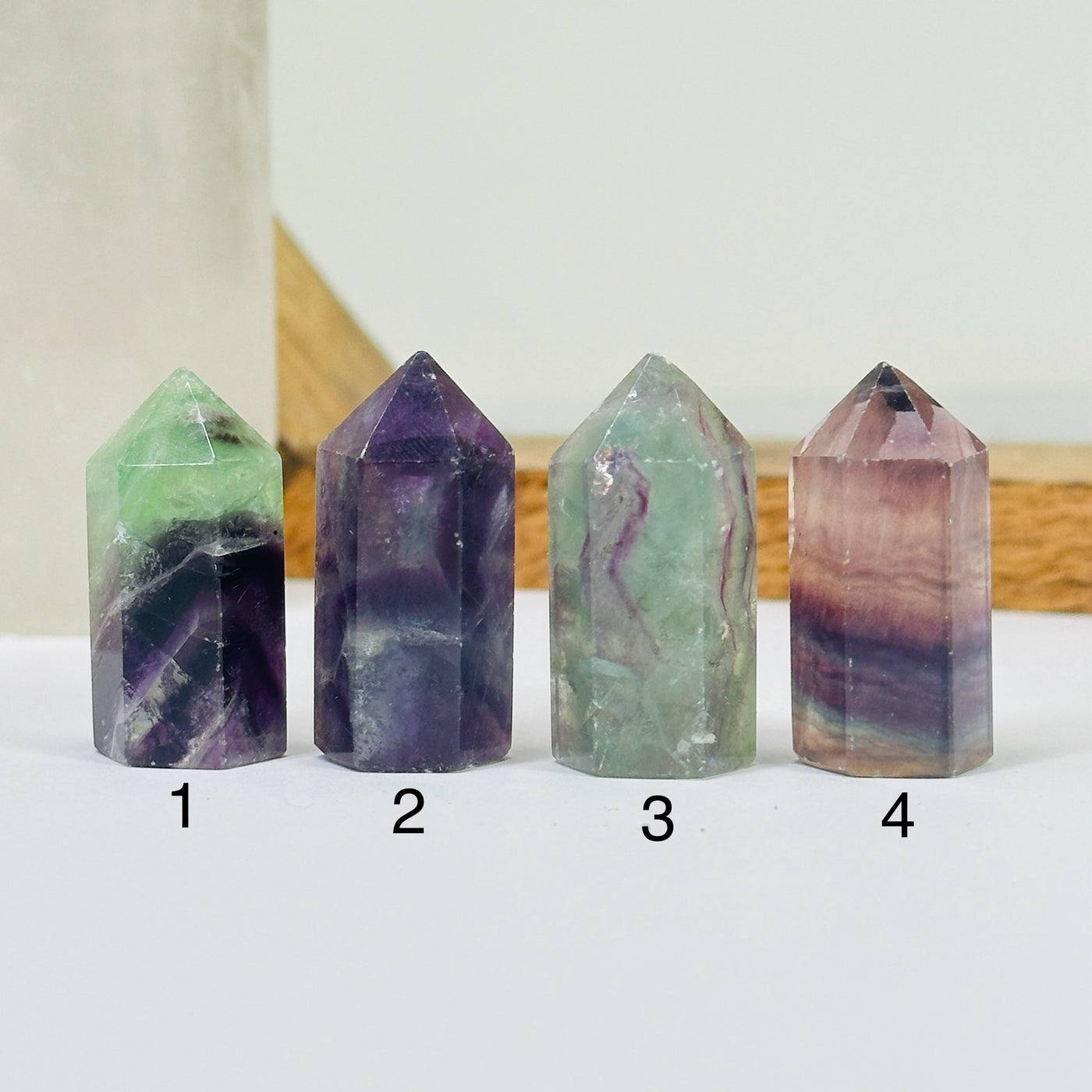 fluorite points with decorations in the background