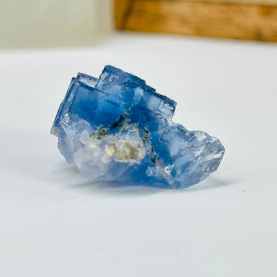 blue fluorite with decorations in the background