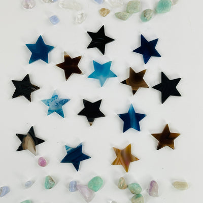 dyed agate stars on white background