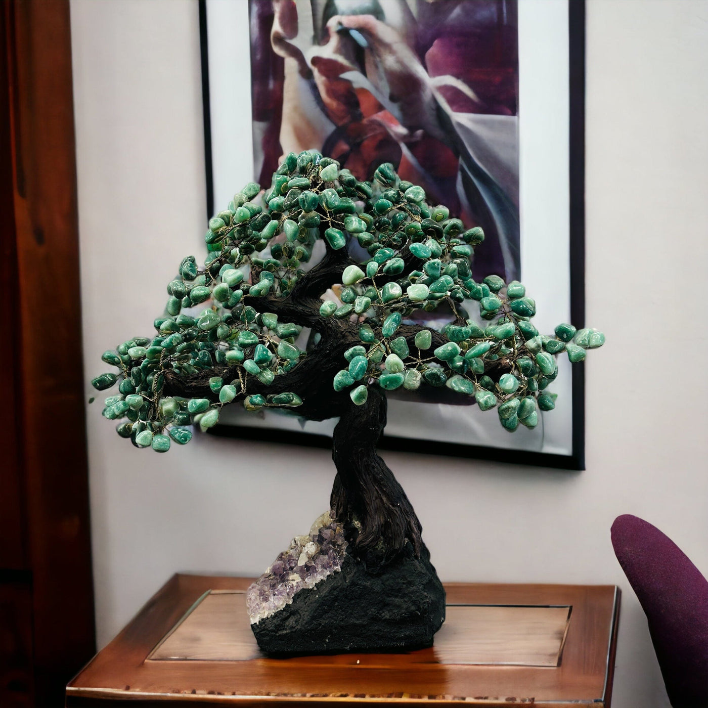 green aventurine tree on amethyst stand with decorations in the background