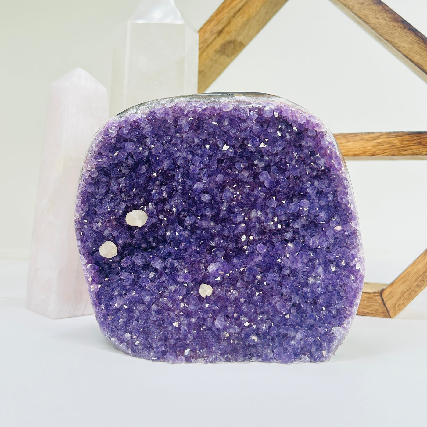 amethyst cut base with decorations in the background