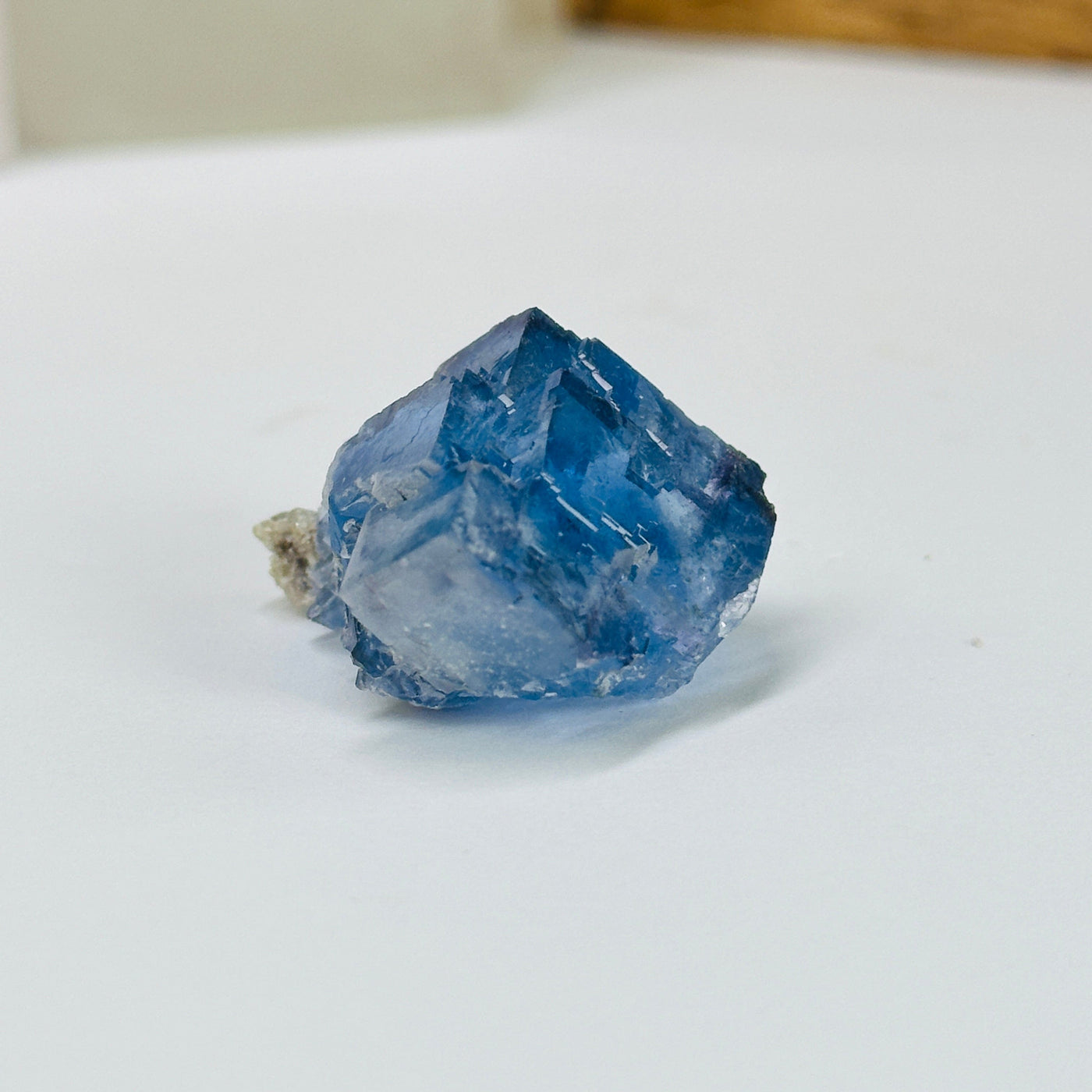 blue fluorite with decorations in the background