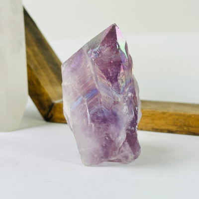 amethyst point with decorations in the background