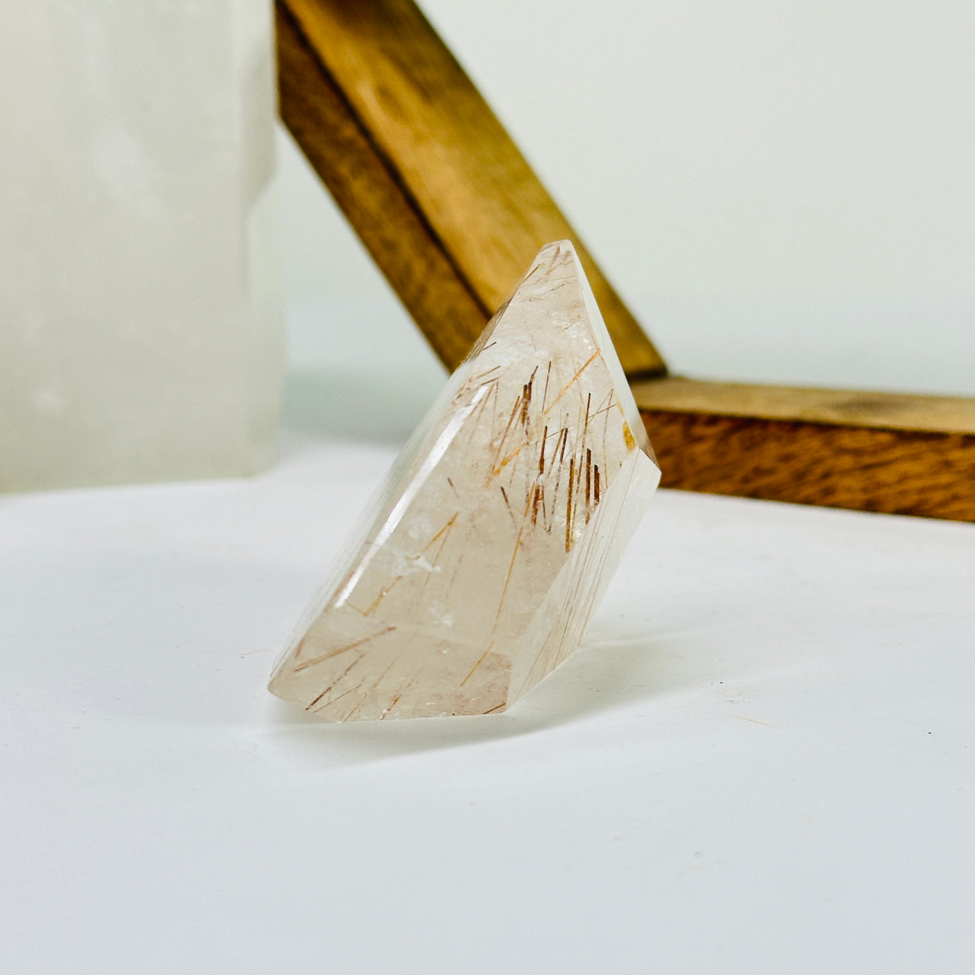 rutile quartz with decorations in the background