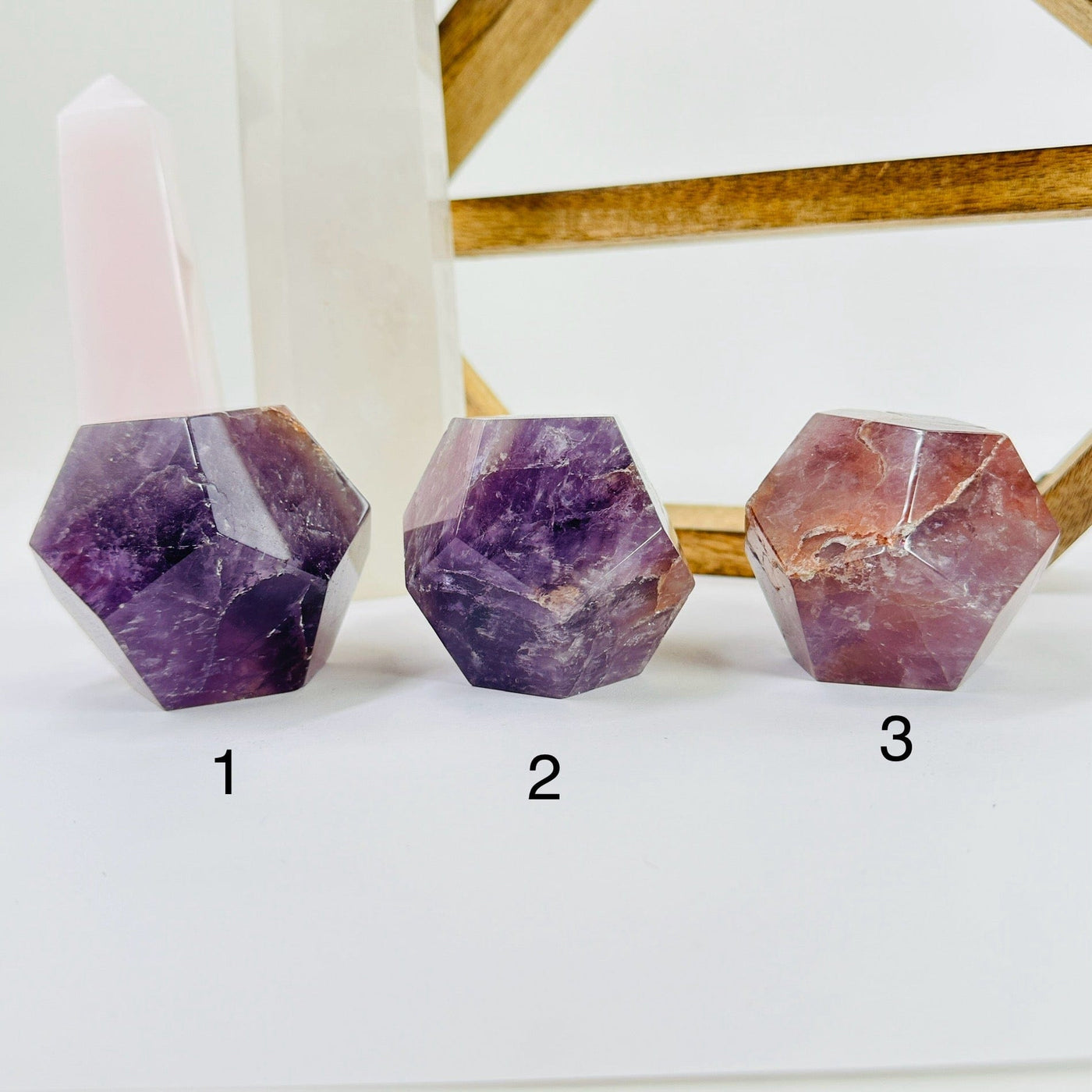 amethyst dodecahedron with decorations in the background