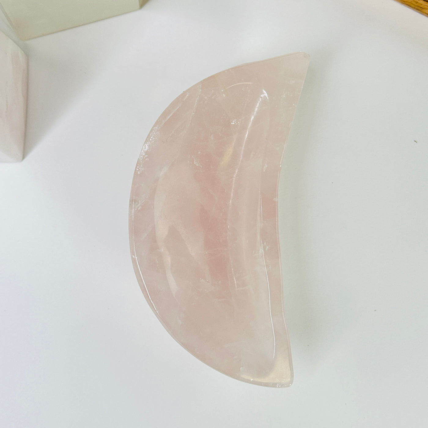 rose quartz bowl with decorations in the background