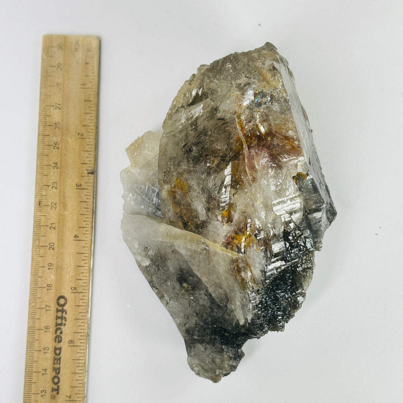 elestial smokey quartz next to a ruler for size reference