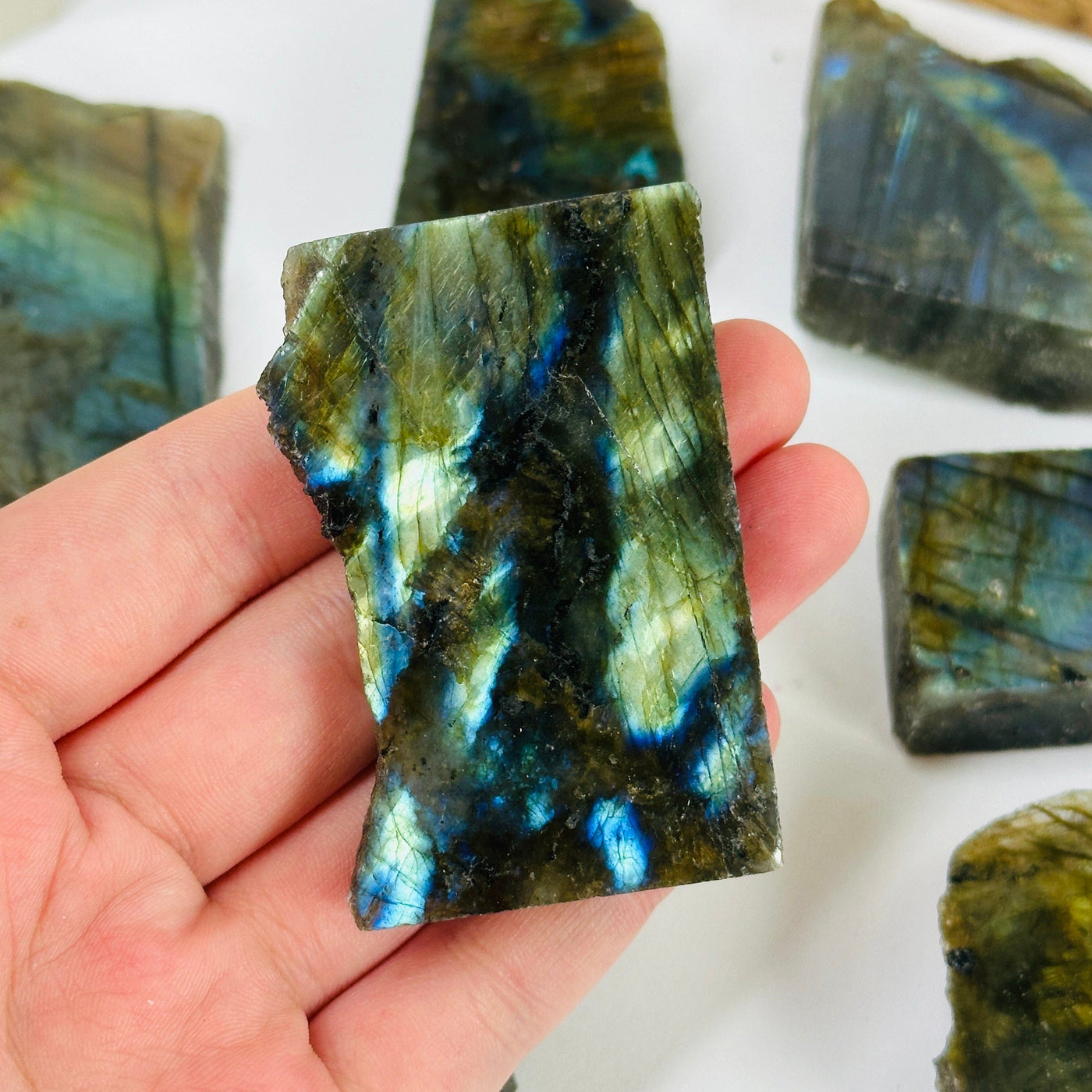 labradorite slab with decorations in the background