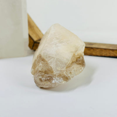 calcite cluster with decorations in the background