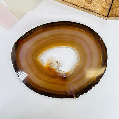 agate slice with decorations in the background