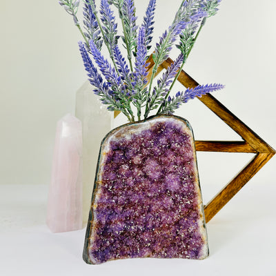 amethyst cut base with decorations in the background