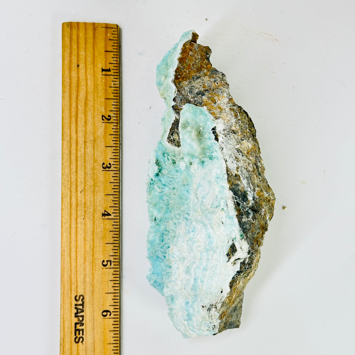 blue aragonite with decorations in the background