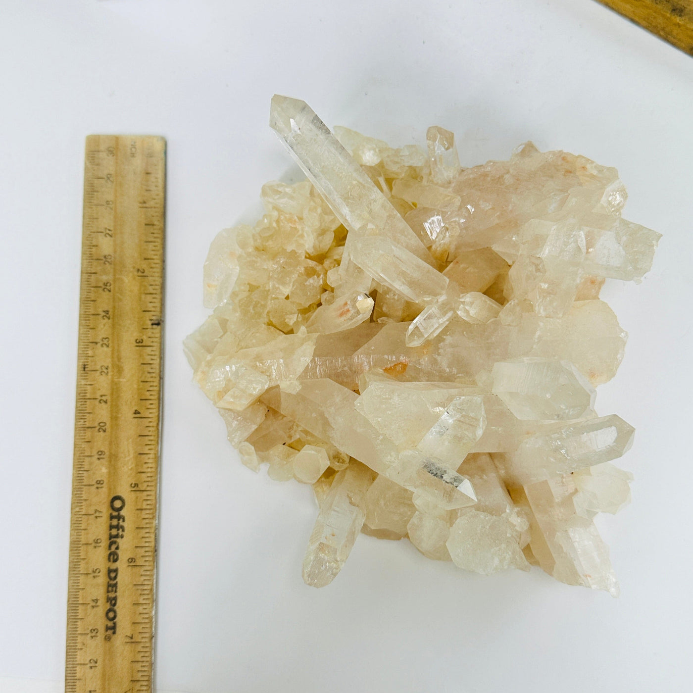 lemurian quartz next to a ruler for size reference