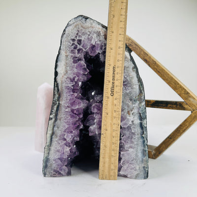 amethyst cathedral next to a ruler for size reference