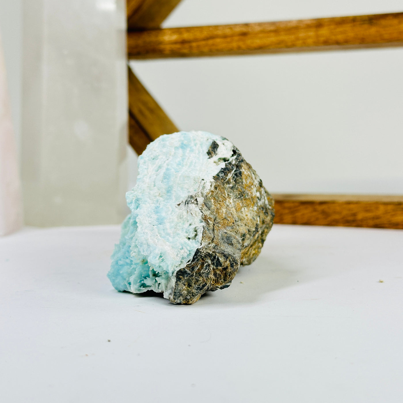 blue aragonite with decorations in the background