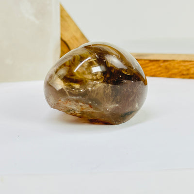 smokey quartz with decorations in the background