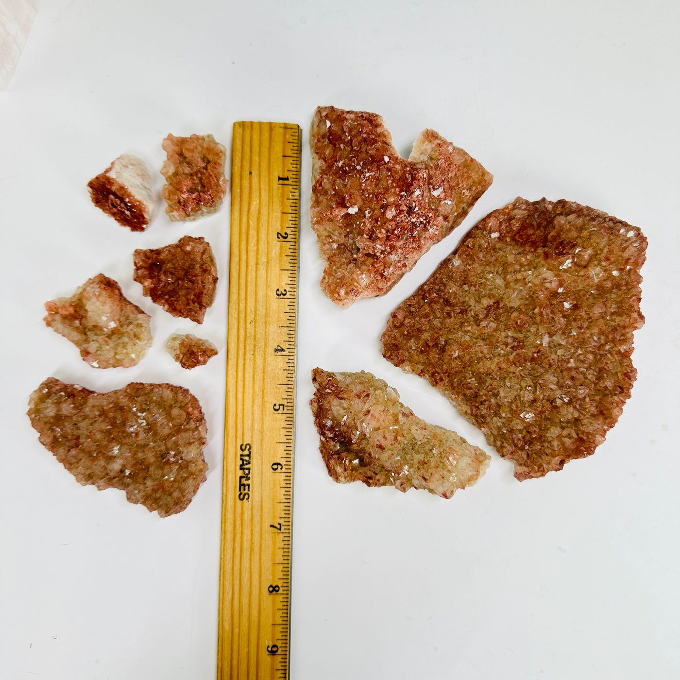 lithium quartz next to a ruler for size reference