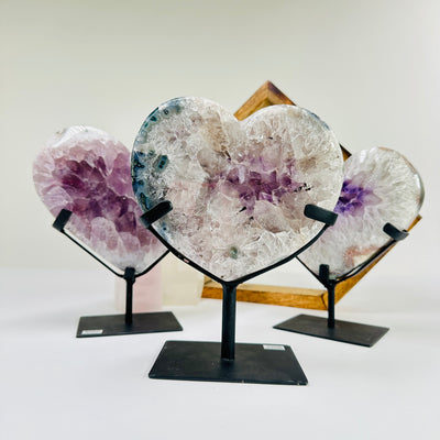 amethyst HEART with decorations in the background