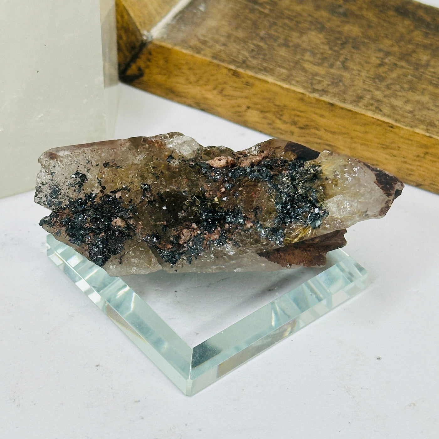 rutilated quartz with decorations in the background