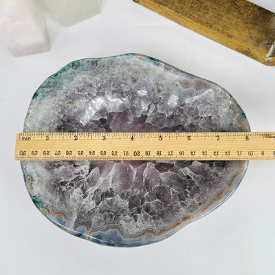 amethyst bowl next to a ruler for size reference