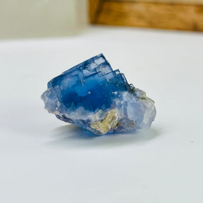 blue fluorite with decorations in the background