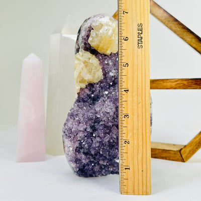 amethyst cut base next to a ruler for size reference