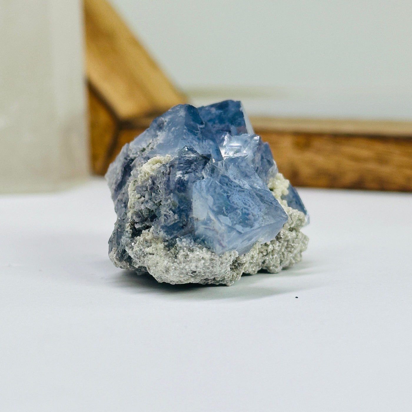 blue fluorite with decorations in the background