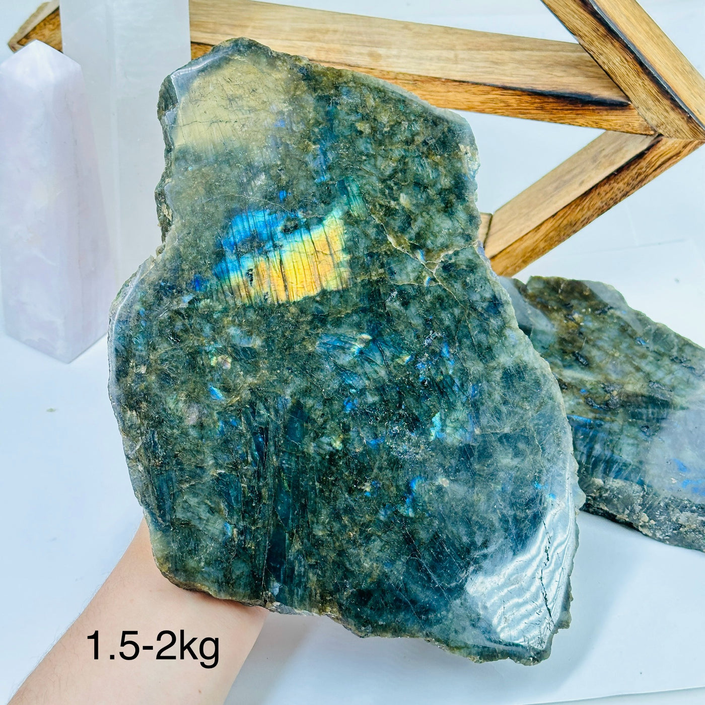 labradorite slab with decorations in the background