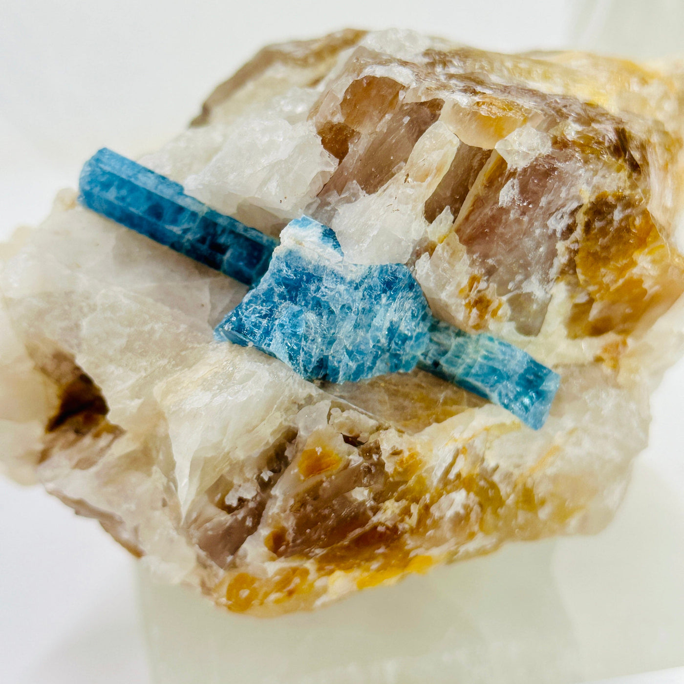 Aquamarine in matrix - aquamarine crystal embedded in large natural rough stone close up detail
