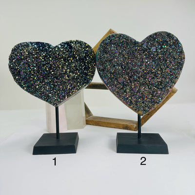 titanium coated heart on stand with decorations in the background