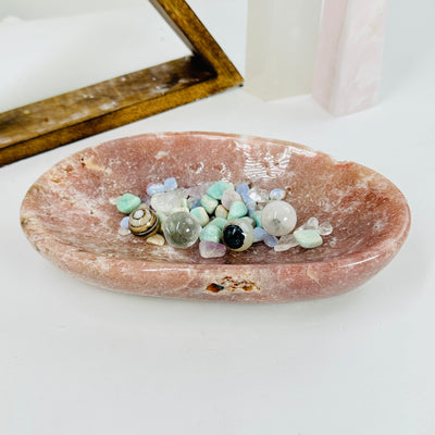 pink amethyst bowl with decorations in the background