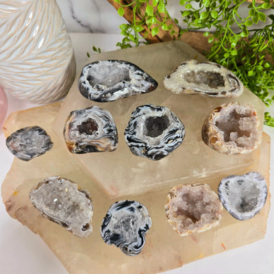 Agate Geode Half - Occo Agate Crystal Geode - You Choose all variants on quartz platters with props in the background